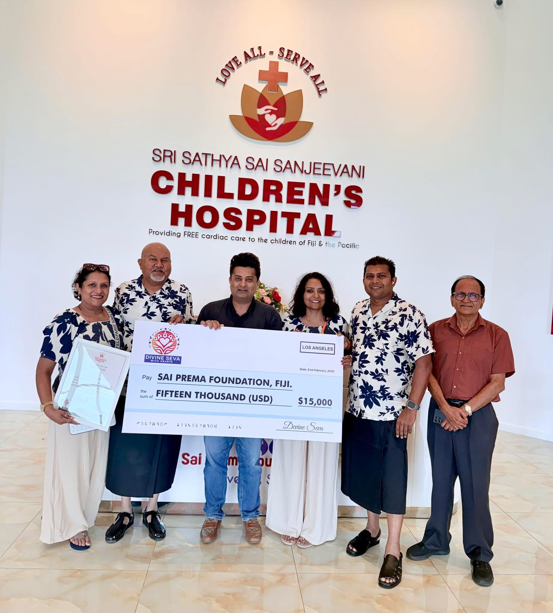 Divine Seva presenting a fifteen-thousand-dollar contribution to Sai Prema Foundation Fiji